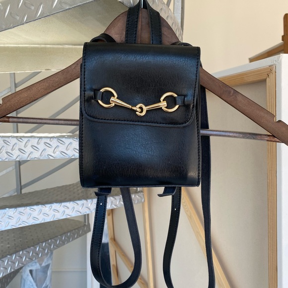 Brandy Melville Handbags - Brandy Melville mini leather horse-bit backpack